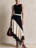 Asymmetrical long dress with polka-dot paneling and lace trim