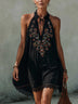 Black sleeveless mini dress with embroidery and a spliced lace hem
