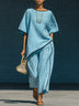 Minimalist blue irregular-hem top and wide-leg trousers set