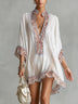 Flowy white mini dress with brown zebra-print panels