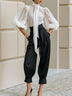 White sheer lace-up shirt and high-waisted lantern pants set
