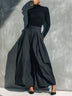 Black high-neck top and dark gray wide-leg trousers set
