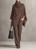 Two-piece set featuring a high-neck cape-style top and wide-leg trousers.