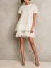 Minimalist solid-color short-sleeve mini dress with a fringed hem