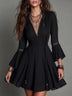 Black V-neck mini dress with lace paneling and lace-up detail