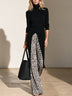 Black long-line turtleneck top and leopard-print trousers set