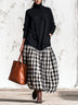 Black high-neck long dress with a spliced plaid skirt section