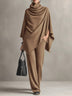 Two-piece set featuring a high-neck cape-style top and wide-leg trousers.