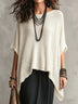 Open-knit round-neck top with an asymmetrical hem