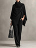 Two-piece set featuring a high-neck cape-style top and wide-leg trousers.