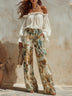 Elegant off-the-shoulder chiffon blouse and printed pants set