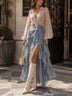 White sheer shirt paired with a blue layered skirt set