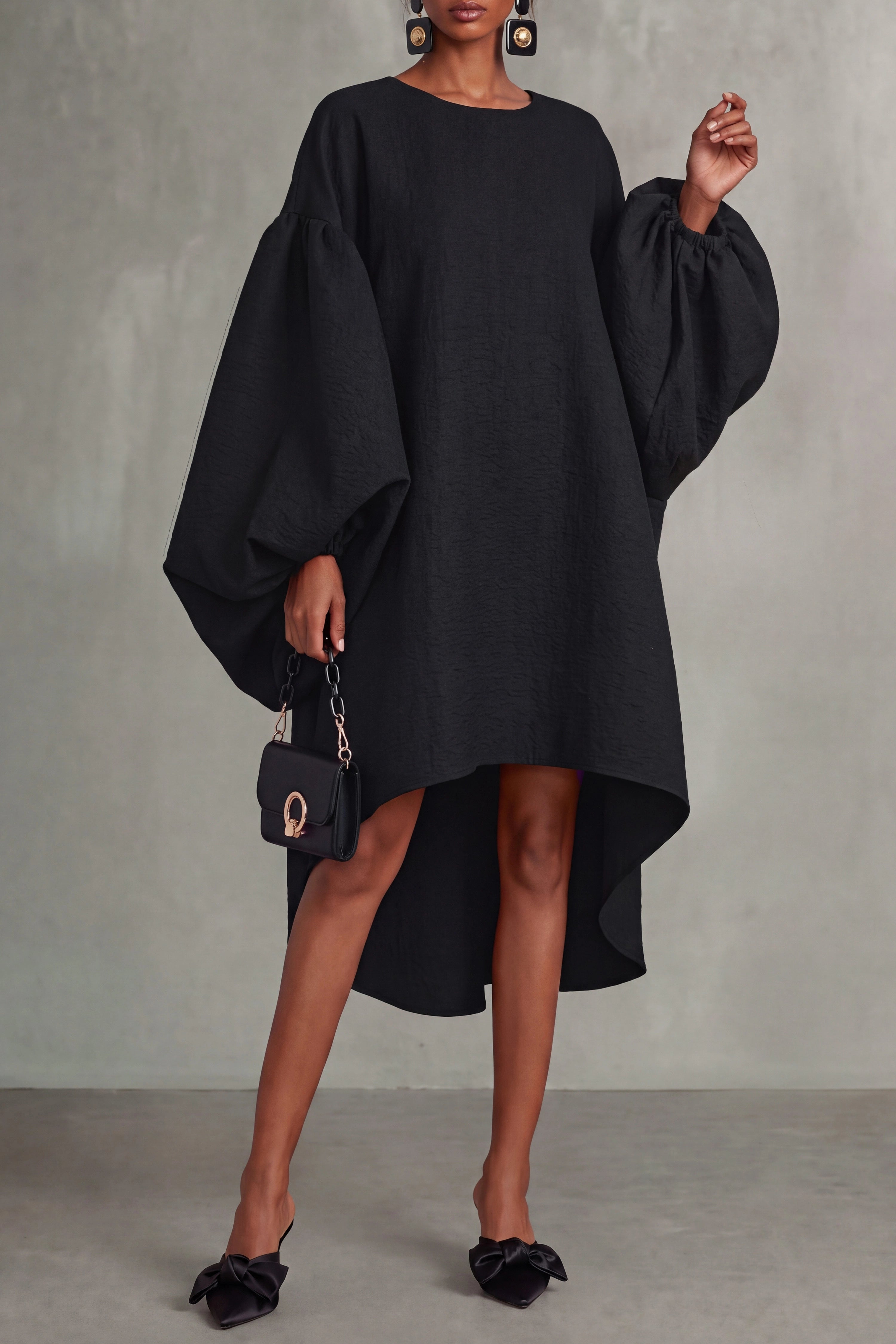 Black oversized puff-sleeve midi dress with a high-low hem