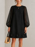 Black Sheer Long-sleeved Mini Dress Featuring Bold Floral Accents On The Skirt