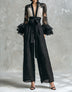 Black lace-sleeve V-neck jumpsuit with bow-tie waist