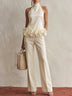 Elegant high-neck top with 3D floral hem and trousers set